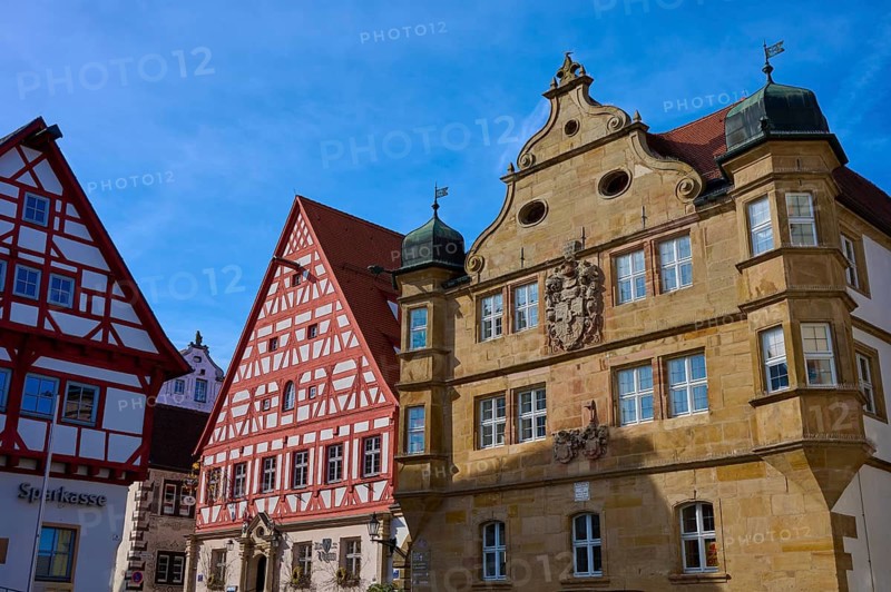 A series of historic half-timbered houses with elaborate architecture under blue skies, Wolframs-Eschenbach, Ansbach district, Middle Franconia, Bavaria, Germany