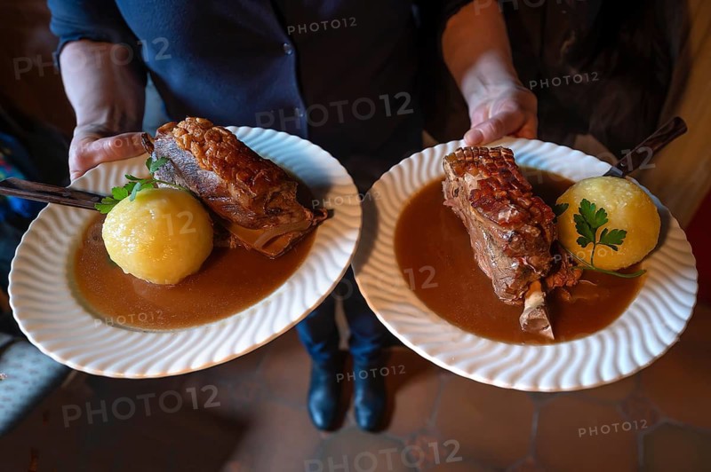 Two Schäuferle with dumpling and sauce, pork shoulder served in a Franconian tavern, Franconia, Bavaria, Germany