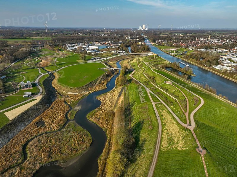 Castrop-Rauxel, North Rhine-Westphalia, Germany - EMSCHERLAND adventure park, new nature and water adventure park on the restored Emscher, at the Emscher water cross with the Rhine-Herne Canal on the city limits of Recklinghausen to Castrop-Rauxel. A new vineyard in front. Flood protection through area expansion. The ecological focus at the confluence of the Suderwicher Bach and Emscher rivers will also be a future garden of the IGA 2027 International Garden Exhibition. Before the restoration, the river system of the Emscher was an open, aboveground waste water channel, mixed water channel with surface water and waste water. Back right, the new bridge jump over the Emscher. On the horizon, the Datteln 4 power plant