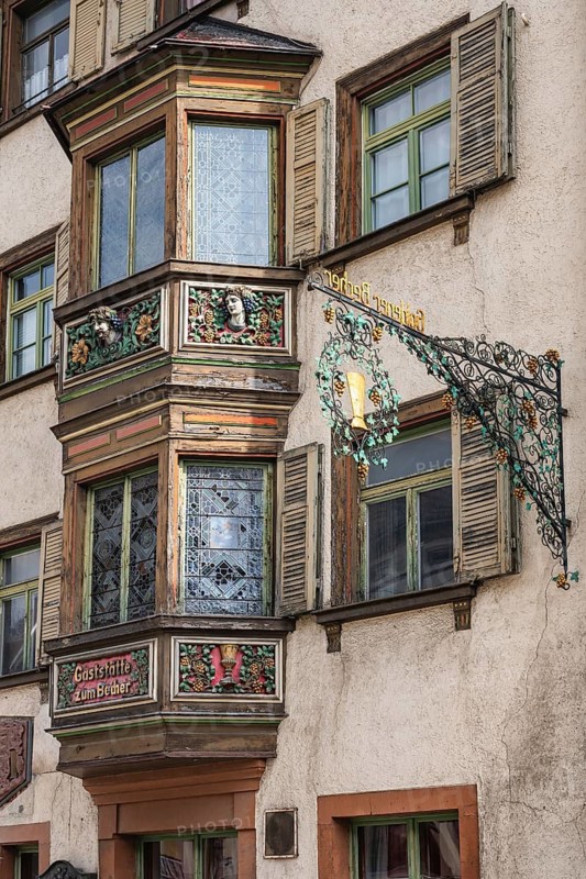 Detailed view of the former Gasthaus zum goldenen Becher in the historic old town of Rottweil, which was already mentioned as an inn in 1713. The wooden bay window was artfully decorated by the well-known German sculptor and mask carver German Burry, Rottweil district, Baden-Württemberg, Germany