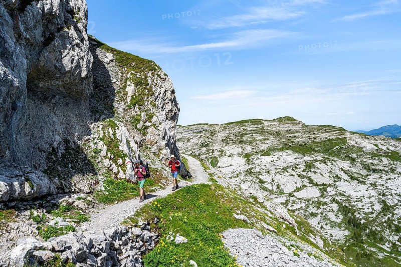 Hikers on a hiking trail on the Schynige Platte, picturesque mountain landscape, Bernese Alps, Bernese Oberland, Switzerland