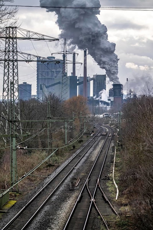 Prosper coking plant, operated by the ArcelorMittal steel group, 146 coke ovens with a daily output of 5500 tonnes of coke, extinguishing cloud, railway line for freight traffic, Bottrop, North Rhine-Westphalia, Germany