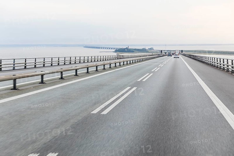 Highway over the Storebelt Bridge, view of the artificially enlarged island of Sprogø and the West Bridge, Denmark