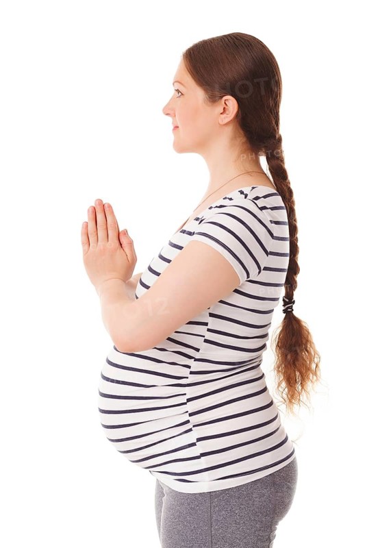 Pregnancy yoga exercise, pregnant woman doing asana adasana namaste -Mountain pose with salutation isolated on white background