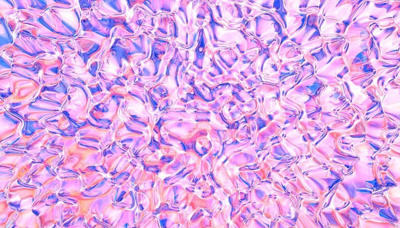 A vibrant abstract texture with fluid shapes in pink and blue colors, creating a mesmerizing and dynamic pattern. Perfect for backgrounds, art projects, or design elements