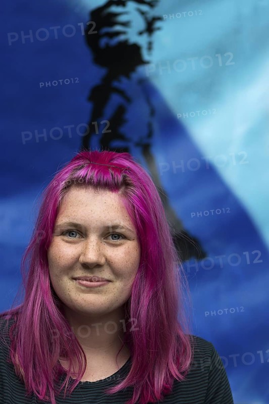 Portrait of a young woman with freckles and violet-colored hair, Ringsheim, Baden-Württemberg, Germany