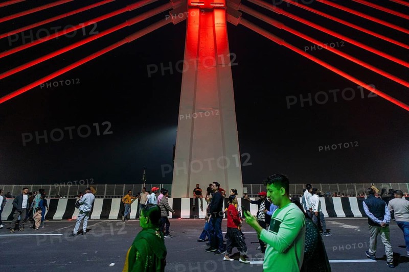 People gather on the newly inaugurated Kumar Bhaskar Varma Setu, a six-lane cable styled bridge over the Brahmaputra River, in Guwahati, India on 15 February 2026