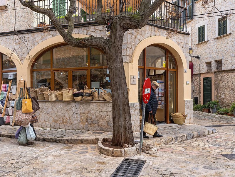 Small alleys with cafes, restaurants and fashion stores in the picturesque mountain village of Valdemossa, Majorca, Balearic Islands, Spain