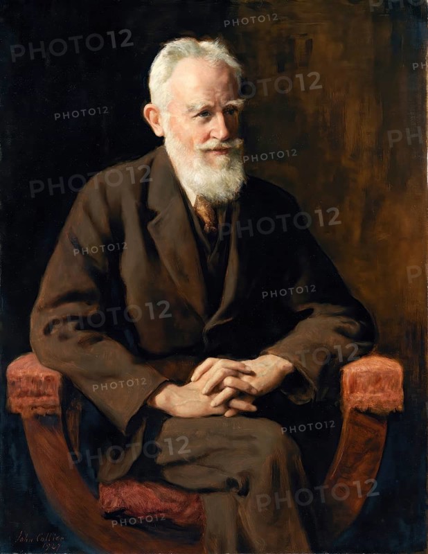 John Collier (born 28 January 1850 in London, died 11 April 1934), British writer and painter in the Pre-Raphaelite style, here his work: portrait of George Bernard Shaw, Dramatist (1927), Elderly man in a brown suit sits on a chair with a satisfied expression