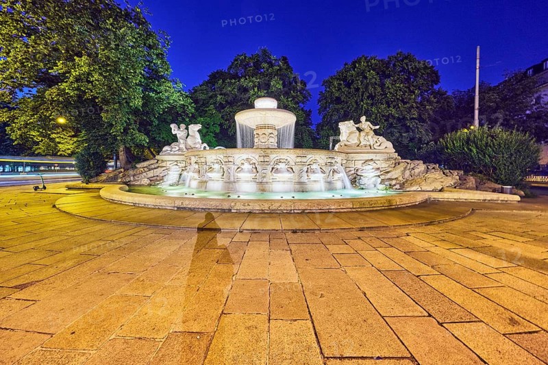 Wittelsbach fountain, cascade fountain, neoclassical art movement, sculptor Adolf von Hildebrand, trees, image processing brightnesses and contrasts, deep blue evening sky, cloudless, Maximiliansplatz, Munich, state capital, district-free city, Bavaria, Germany