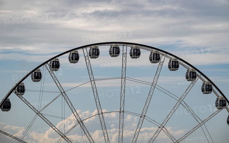 Gondolas, towering Ferris wheel against a cloudy sky, overseas port, Rostock, Mecklenburg-Western Pomerania, Germany