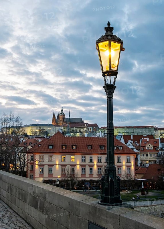 Lit-up street light and Prague Castle, Praha, Czech Republic
