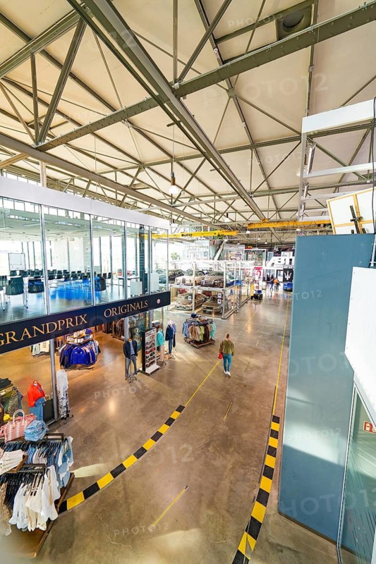 Bright shopping area with clothing, high ceilings and plenty of daylight, Motorworld Böblingen, Germany