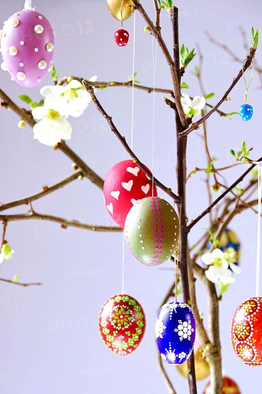 Easter, Easter bouquet with colorful Easter eggs, branches with flowers of an ornamental quince, spring, Germany
