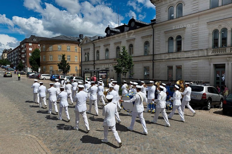 Musicians in white uniforms, military band roaming the streets of Karlskrona, Götaland, Blekinge, Sweden