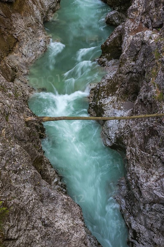 The Lammer creek is flowing fast through the Lammerklamm on a sunny hiking day