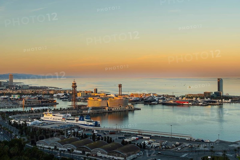 View of the old harbour and the city of Barcelona in the evening light, Spain