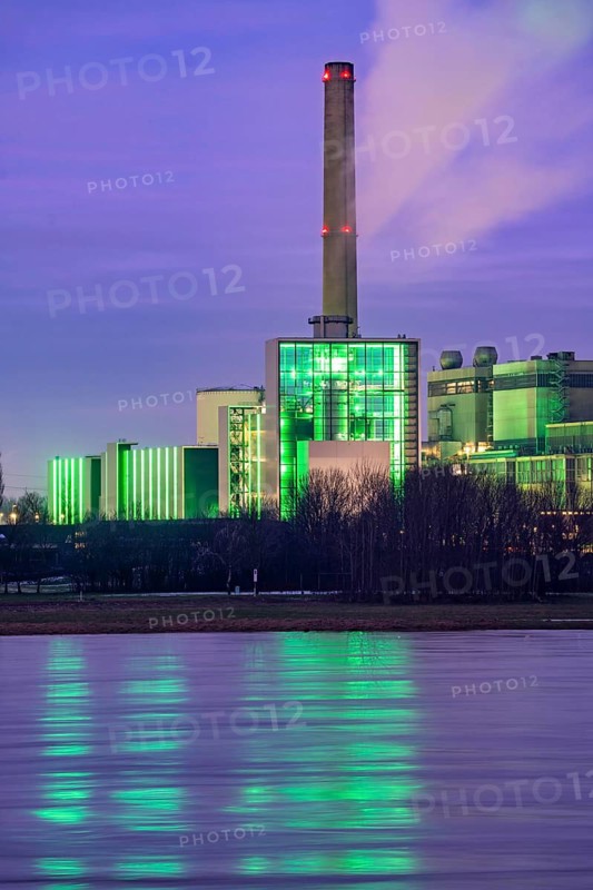The Lausward combined heat and power plant in Düsseldorf, gas and steam turbine power plant, operated by Stadtwerke Düsseldorf and EnBW, on the Rhine, green illuminated city window, the chimney of the Fortuna power plant unit, the power plant generates electricity, also traction current and district heating, North Rhine-Westphalia, Germany