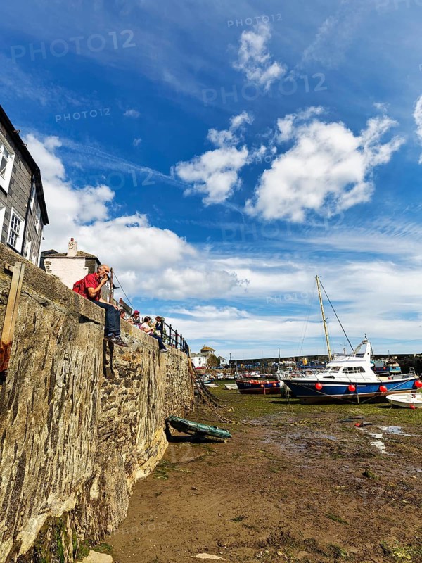Fishing boats in tidal harbour, low tide, Mevagissey, St Austell, Cornwall, England, Great Britain
