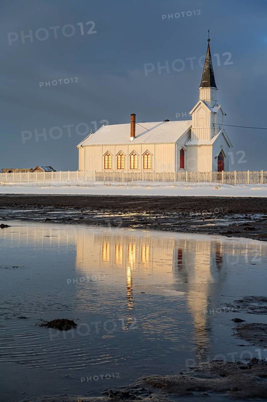 Church in the morning light, cloudy mood, beach, sea, winter, Nesseby Church, Varanger Peninsula, Norway