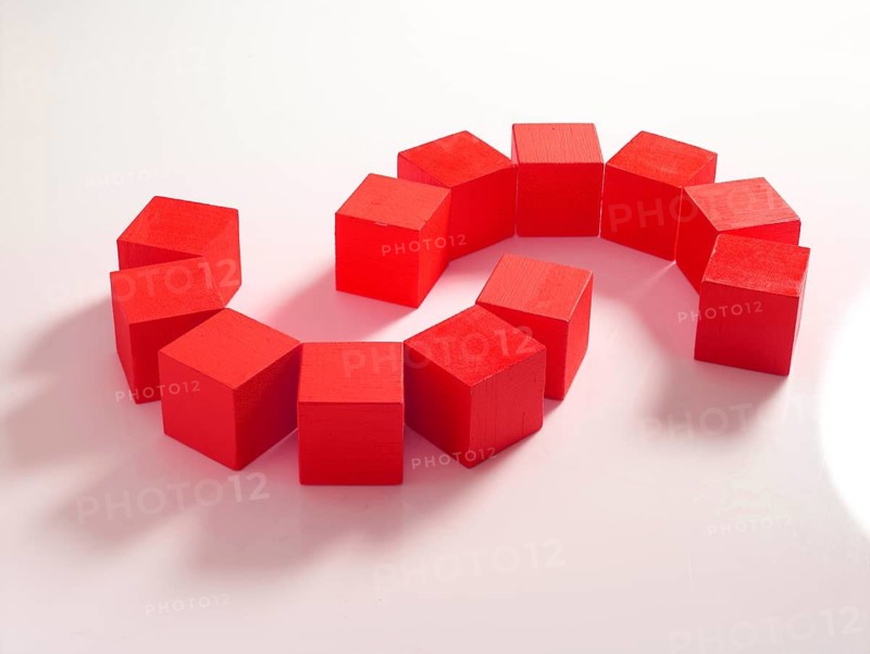 12 red wooden cubes against a white background