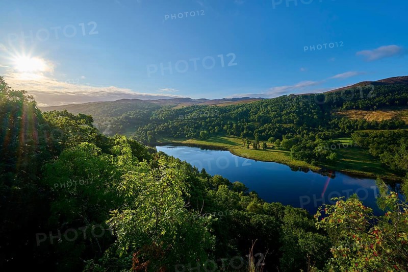 A picturesque landscape with a lake and trees at sunrise, Queens View, Fincastle, Pitlochry, Scotland, United Kingdom, Great Britain