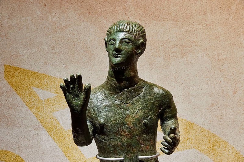Diocouroi or athlete, bronze male statue with raised hand, ornate and antique, Pylos Archaeological Museum, Neokastro, Pylos, Peloponnese, Greece