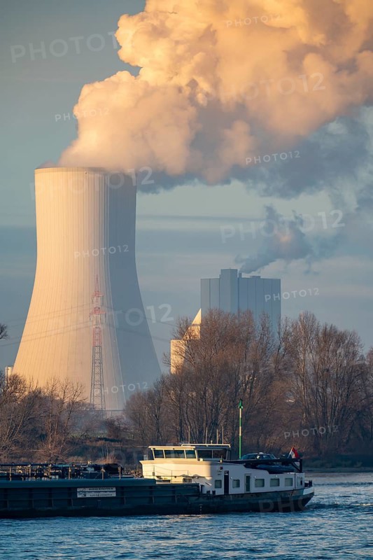 Cooling tower of the coal-fired power plant Duisburg-Walsum, operated by STEAG and EVN AG, 181 metres high, power plant unit 10, water vapour cloud, container cargo ship on the Rhine, Duisburg, North Rhine-Westphalia, Germany