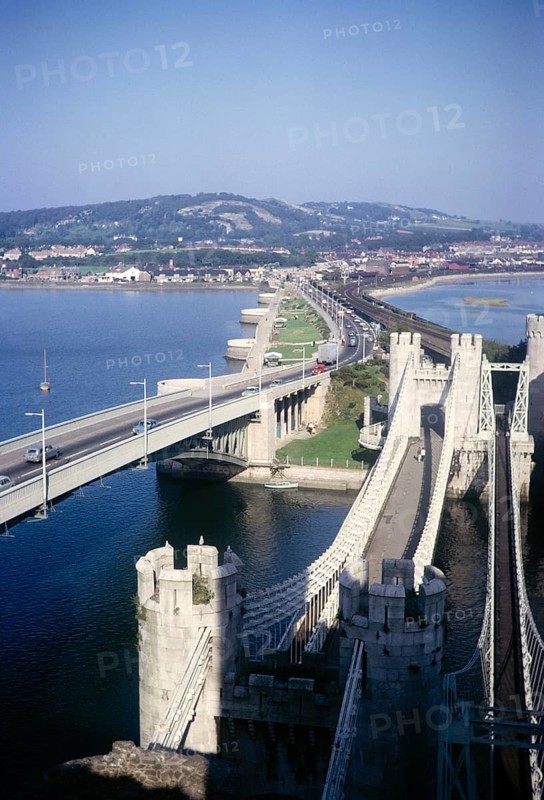 View of the railway bridge over the River Conwy and the Telford Suspension Bridge, Conwy, Anglesey, North Wales, Wales, UK 1966