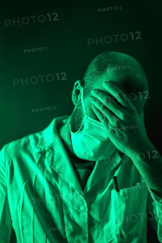 A doctor working with great sorrow in the coronavirus pandemic, Covid-19