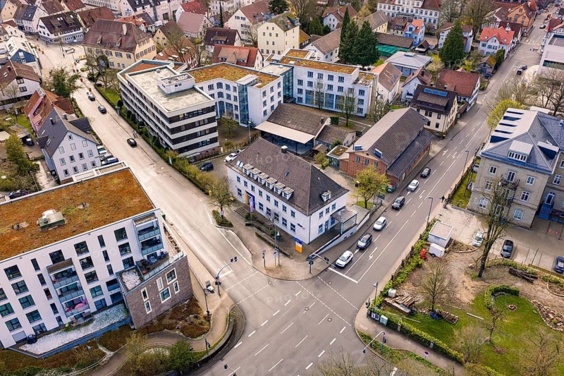Dense urban landscape with a central road junction and surrounding residential and commercial buildings, VHS Oberes Nagoldtal, Nagold, Germany