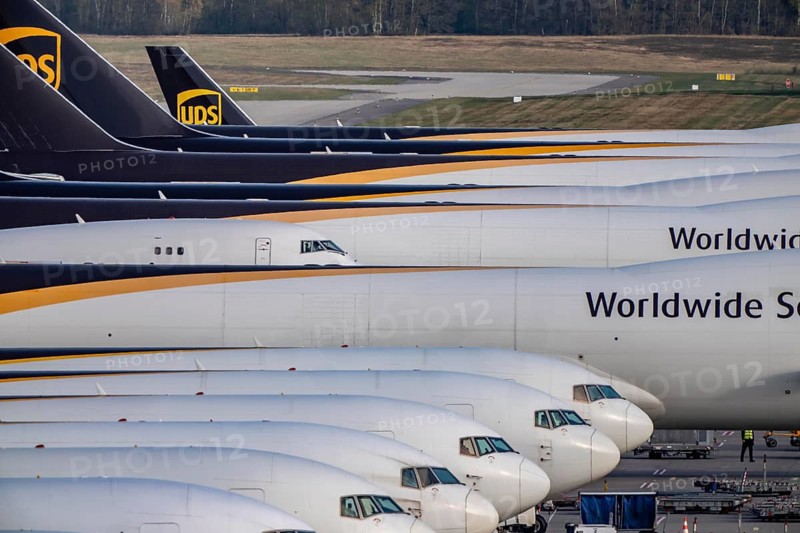Cologne-Bonn airport, CGN, air freight center, UPS logisic hub, UPS cargo aircraft on the apron, at the logistics center, Boeing 747 freighter in the back