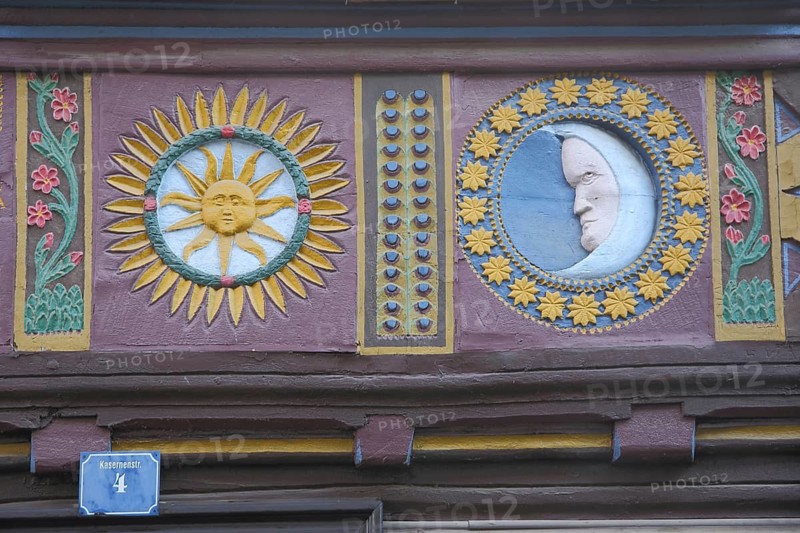 Floral figures of bright sun and moon, moon face with circle stars, wood carvings, handicrafts, half-timbered house, Butzbach, Wetterau, Hesse, Germany