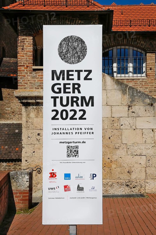 Poster Metzgerturm 2022 Installation by Johannes Pfeiffer, information board, logos, advertising, writing, letters, QR code, temporary art in public space, contemporary art, Ulm, Baden-Württemberg, Germany