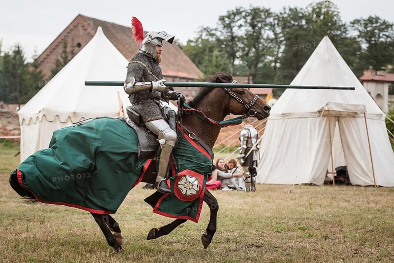 LUBIAZ, POLAND - AUGUST 25, 2018: Monastery Siege - historical staging. Knights horse riding show