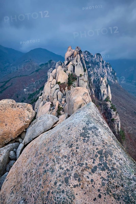 View of stones and rock formations from Ulsanbawi rock peak in stormy weather with clouds. Seoraksan National Park, South Corea