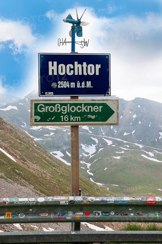 Above small wind wheel for determining wind direction, below information on sign with height indication at highest point of Grossglockner High Alpine Road viewpoint Hochtor, below information about distance to mountain Grossglockner, Grossglockner High Alpine Road, Heiligenblut, Carinthia, Austria