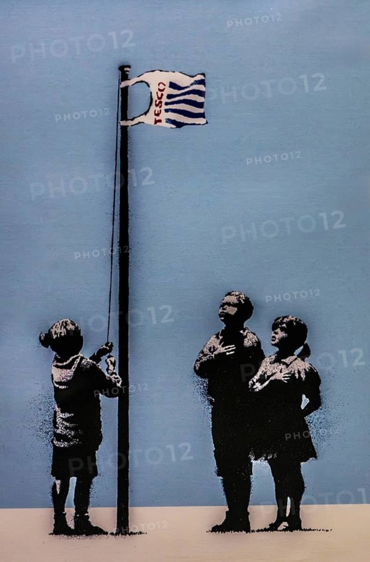 Banksy - Very Little Helps, parody of the Iwo Jima motif with a Tesco bag, 2008, Essex, London, UK, exhibition The World of Banksy