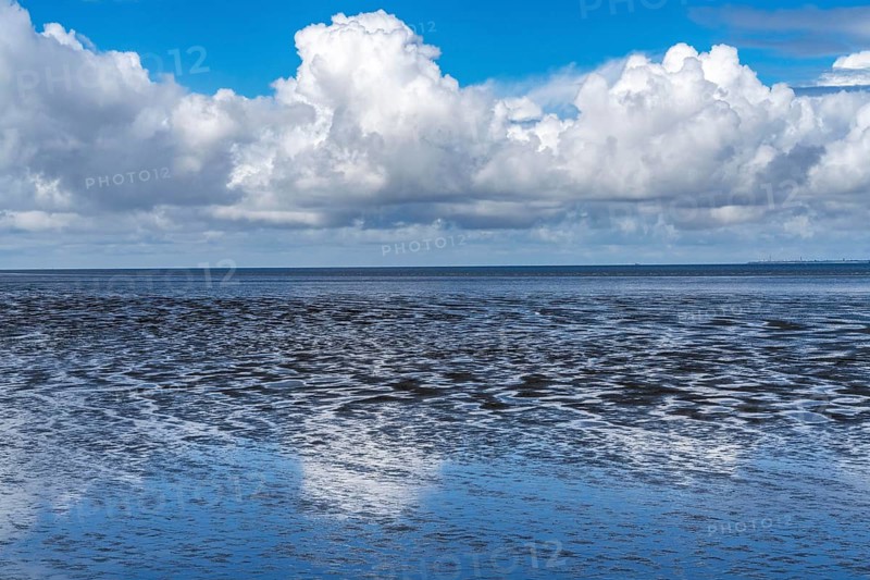 Wadden Sea between the Dutch coast near Eemshaven and the German North Sea island of Borkum, Wadden Sea National Park, UNESCO World Heritage Site, low tide, low water, clouds