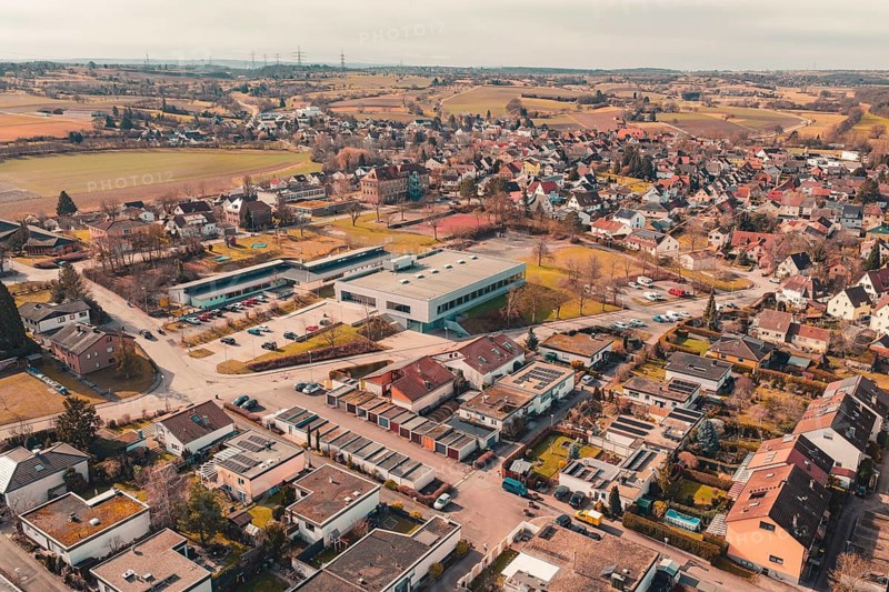 A bird's eye view of a rural town with scattered houses and fields in the area, Ötisheim, Enzkreis, Germany