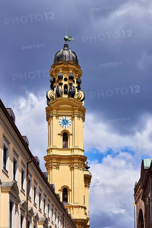 Church tower of the Theatine Church, St. Kayetan and Adelaide, church spire, church tower clock, dome, Italian high baroque style, general architecture, façade with windows, blue sky, white and dark gray cumulus clouds, Theatinerstraße, Odeonsplatz, Munich, state capital, district-free city, Bavaria, Germany