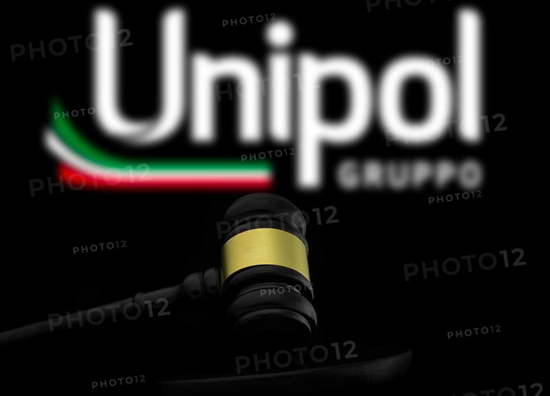 Court gavel in front of the Unipol gruppo logo. Unipol Gruppo S.p.A. is an Italian financial services holding company