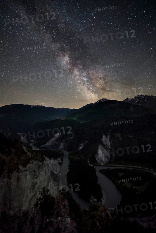 Starlit sky with Milky Way over Rhine Valley, Canton of Grisons, Switzerland