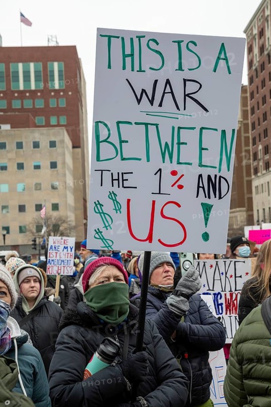 Lansing, Michigan USA - 5 February 2025 - People rally at the Michigan state capitol to oppose President Trump, Elon Musk, and Project 2025. Similar rallies were planned across the country, many of them at state capitols