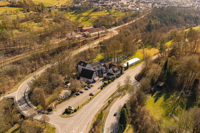 Complex of buildings on a country road surrounded by trees in rural surroundings, Pfrondorf, Nagold, Calw district, Germany