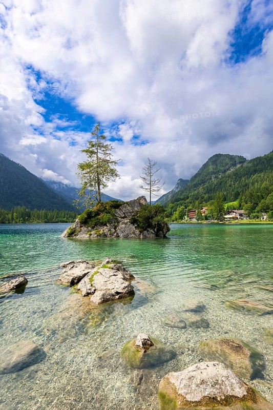 Hintersee near Ramsau with clear green water, surrounded by forests and mountains under a cloudy sky, Berchtesgaden National Park, Berchtesgadener Land, Upper Bavaria, Bavaria, Germany