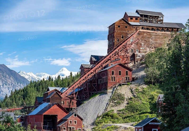 Red Kennicott buildings in front of mountainous landscape, Kennicott Concentration Mill to extract copper from quarried rock, Historic Kennecott Copper Mine, National Historic Landmark, Wrangell St. Elias National Park, Alaska, USA