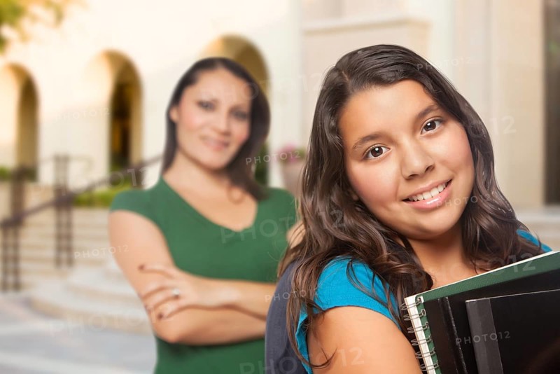 Proud Hispanic Mother and Daughter on Campus At School