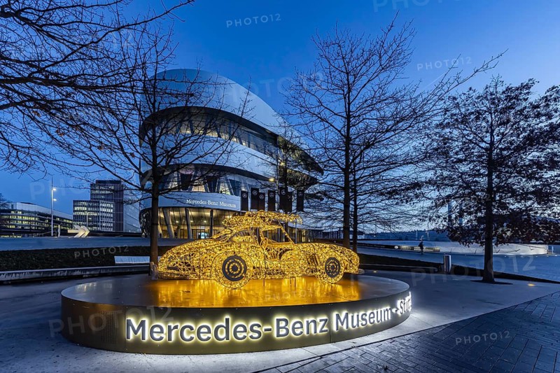 The Mercedes-Benz Museum in Stuttgart presents a journey through the automotive history of the global corporation. 160 vehicles are shown. At Christmas time, there is a light installation in front of the building. It represents the iconic classic Mercedes SL car. Night shot. Stuttgart, Baden-Württemberg, Germany