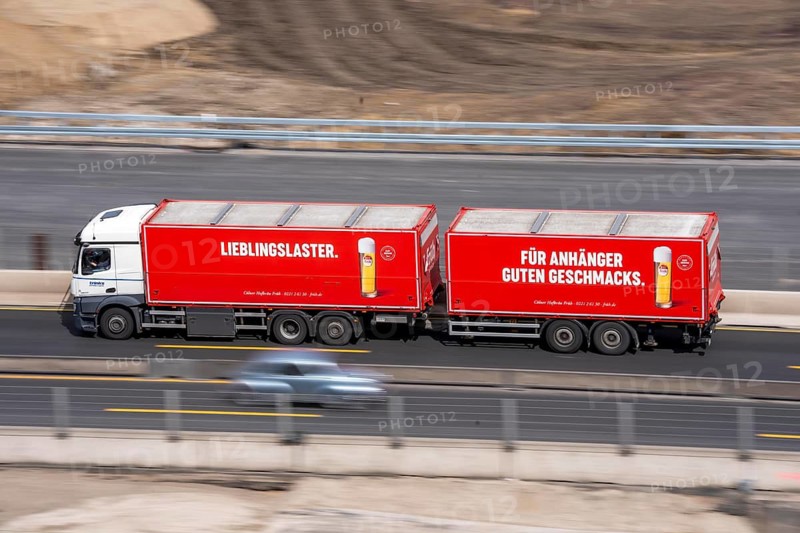 Freight truck for food logistics, on the motorway, beverage transport, advertising for Früh Kölsch